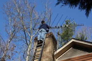 Performing chimney sweeping services