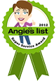 green ribbon that has a womens face drawin on it and says Angie's List Super Services Award 2012