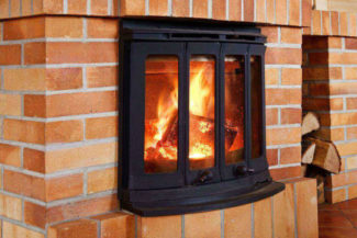 a gas fireplace filled with cozy flames