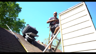 sweep on ladder on roof