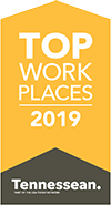 Top Workplaces 2019 Award arrows in yellow and black pointing upwards with Tennessean in black.