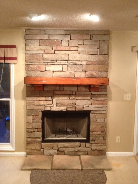 New refinished fireplace with bricks and hearth  windo w on the lefton