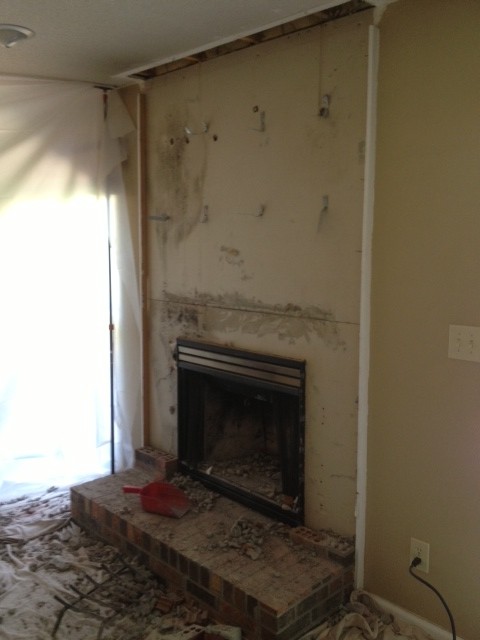 Fireplace with hearth taken down for construction dirt onb  drop clothte