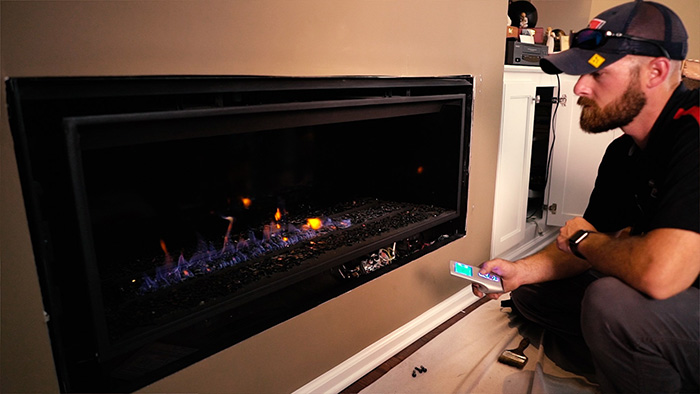 Tech testing electric fireplace - Ashbusters Chimney
