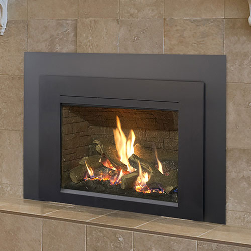 fireplace burning in black fireplace gas insert with large brown tile hearth