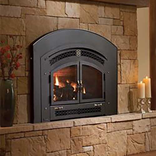 black arched fireplace insert with doors shut and fire burning inside