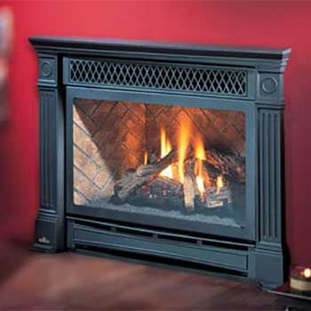 Large Black fire place insert with fire burning in it and a red background behind it