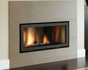 rectangular black fireplace insert with fire burning in it