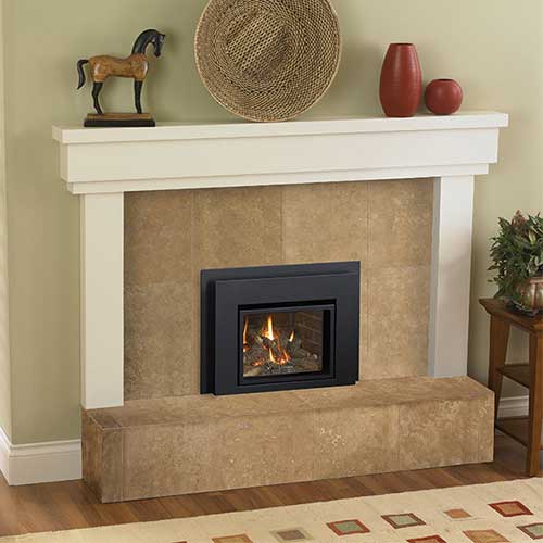 white hearth with small wooden horse wicker basket and vases on top small black fireplace insert with fire burning in it