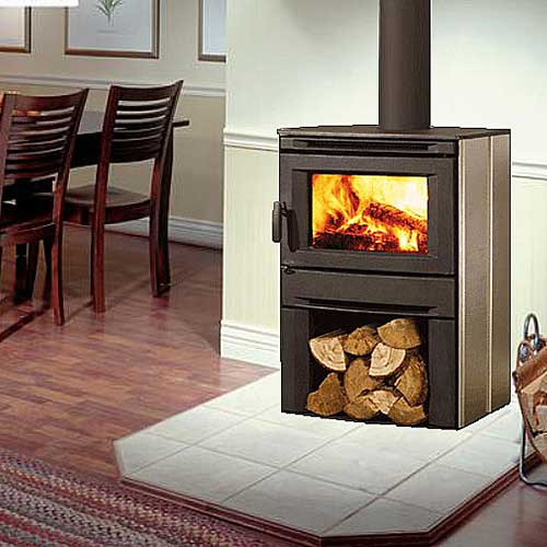 Black Wood Stove with fire burning in it and firewood stored underneath on white floor tiles and kitchen table and chairs to the left