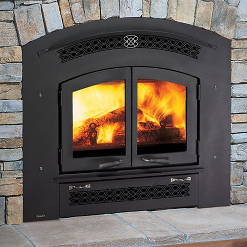 arch shaped black fireplace insert with fire burning in it and mixed colored heath bricks