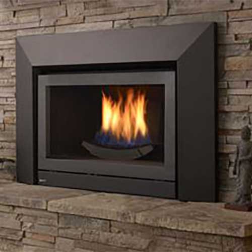 black gas fireplace insert with brown shades of brick and fire burning in it