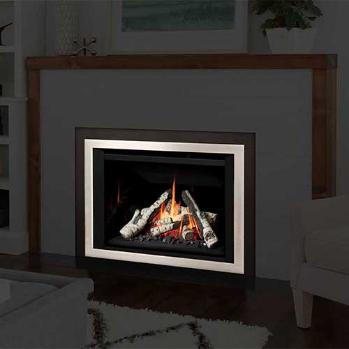 fire in gas fireplace insert with silver frame rest of room image in black