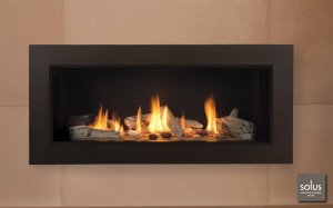 rectangular gas fireplace insert with fire burning