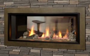 fire burning in aquarium looking gas fireplace with bricks around it