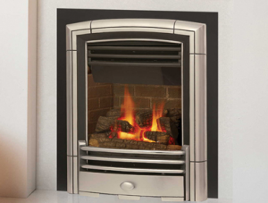 large metal fireplace insert with fire burning in it