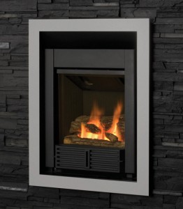 grey framed black fireplace insert with fire burning and grey bricks