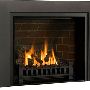 black fireplace insert with fire burning in it