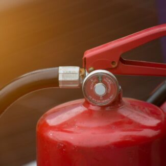 a close up view of the handle and tube of a fire extinguisher