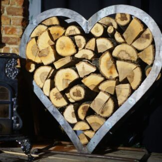 chopped up firewood filling a heart-shapes storage container