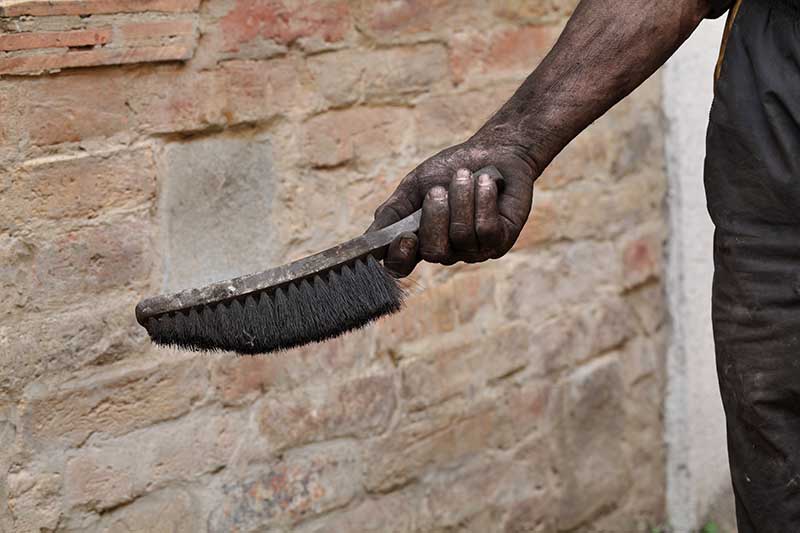 Chimney Sweeper holding brush